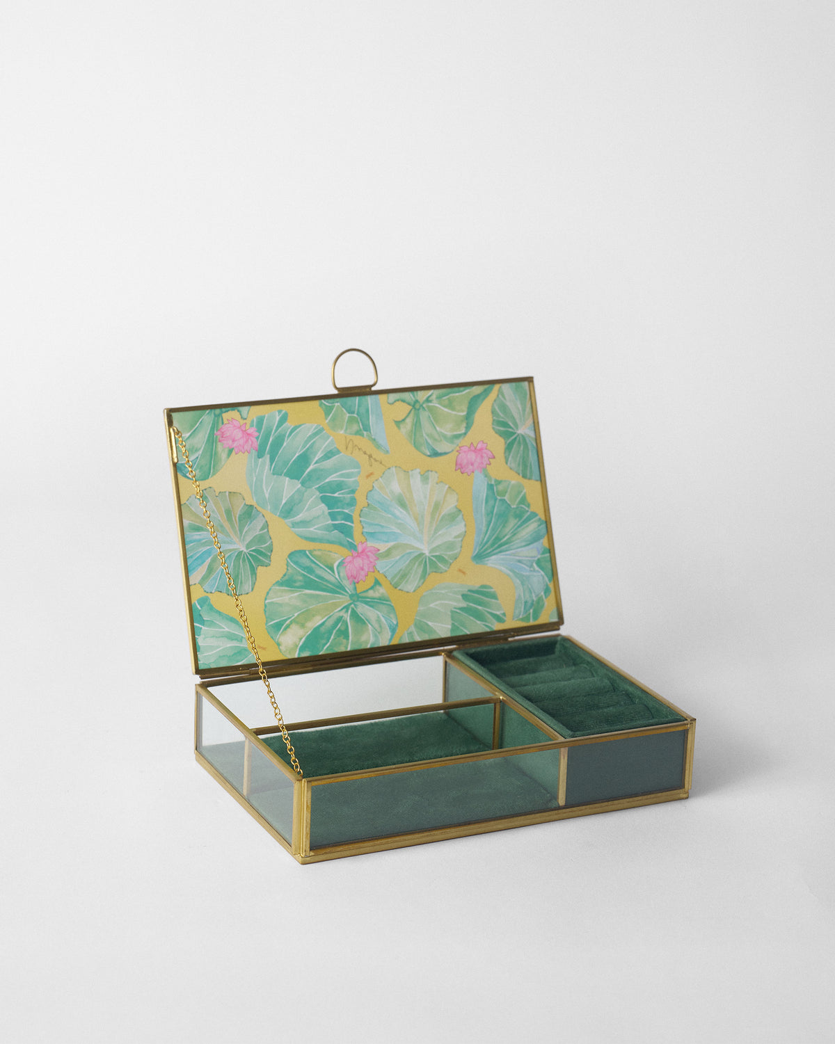 Open Lilly pond jewellery box with green velvet compartments.