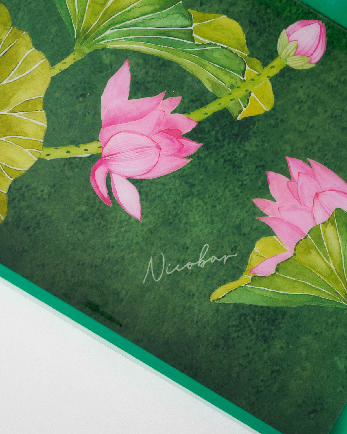 Close-up of Lotus rectangular tray showing pink lotus and green leaves.