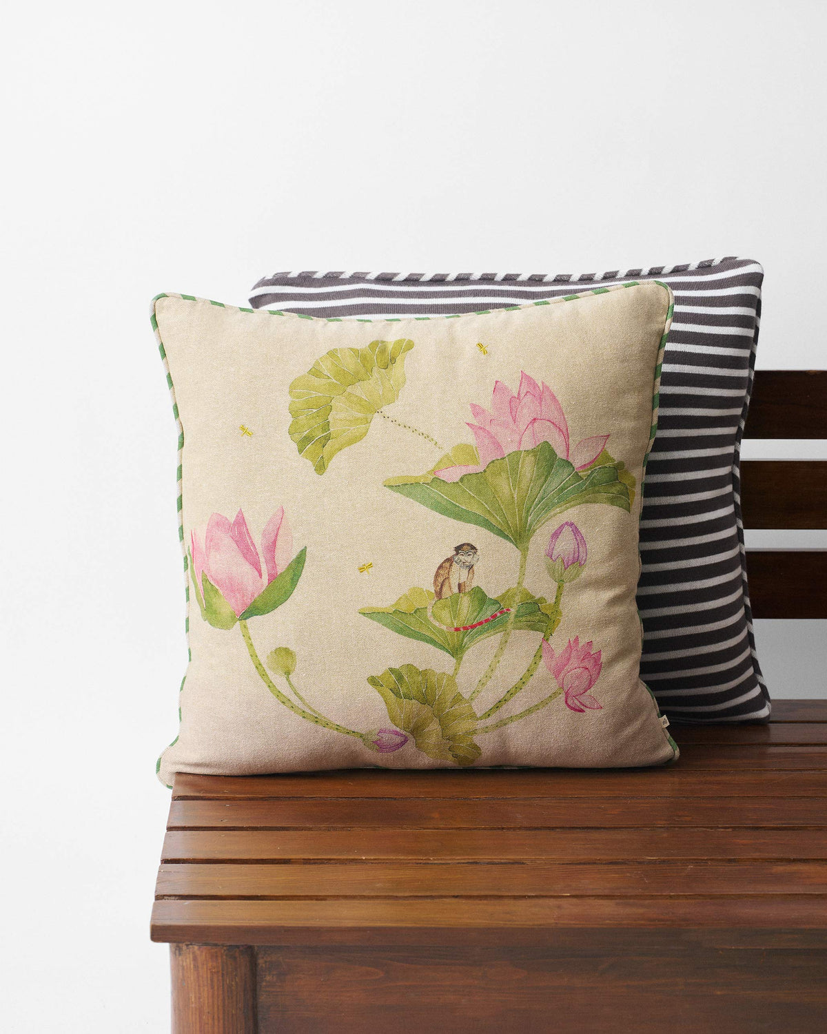 Beige Lotus cushion cover with pink lotuses, leaves and a small monkey.