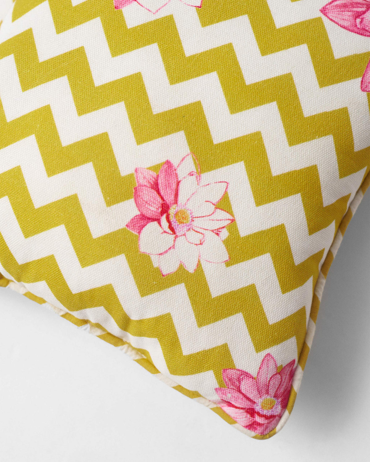Close-up of Chevron Lotus Car Cushion showing a pink lotus on yellow chevrons.