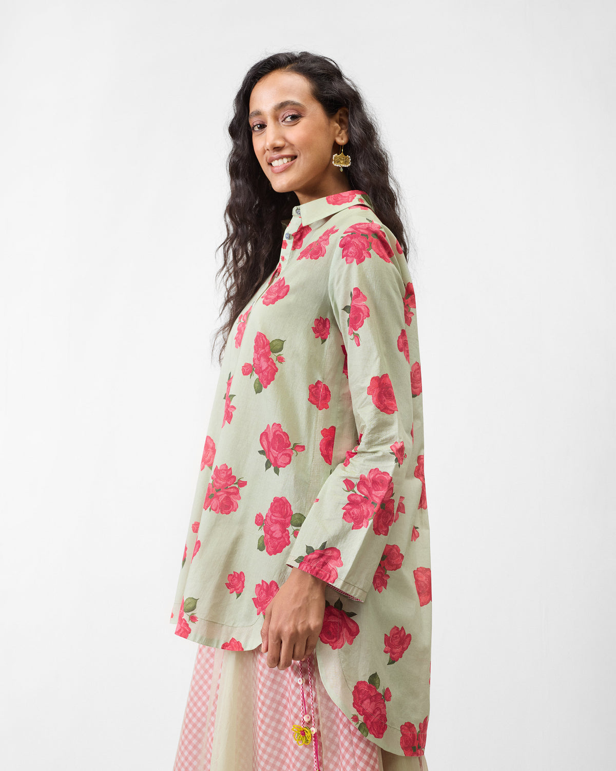 Side view of a mint High Low Shirt showing a longer back hem.