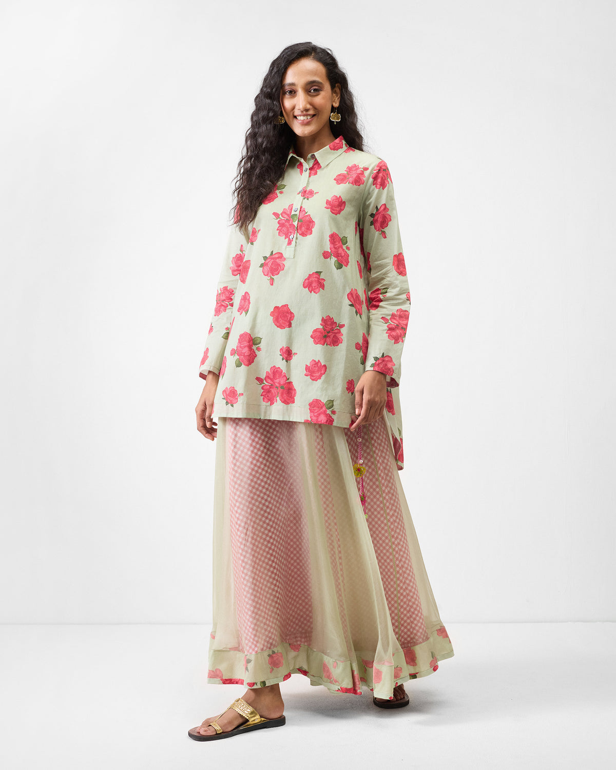 Person wearing a mint High Low Shirt with a watermelon rose print.