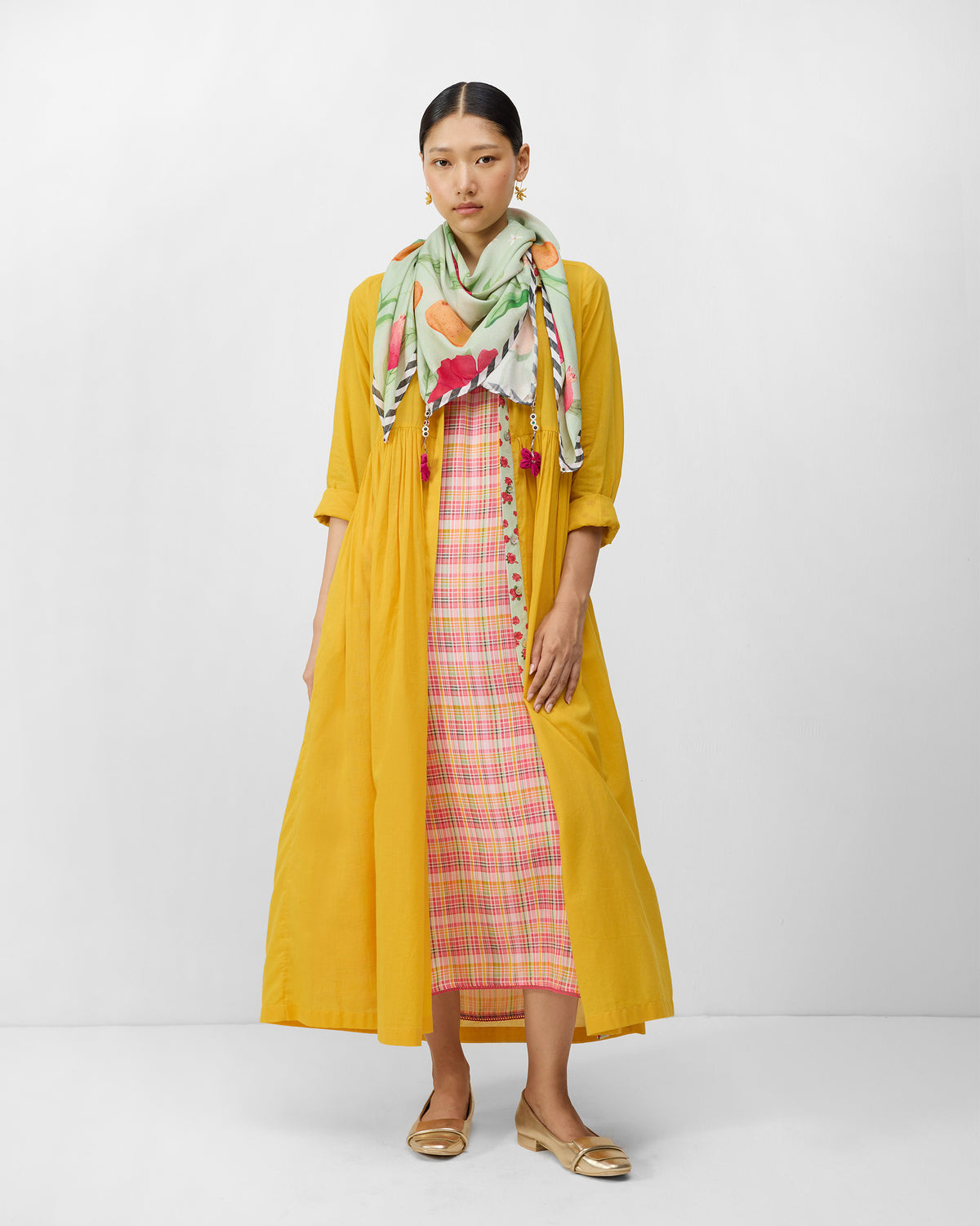 Aurora Dress worn open over a pink check slip with a floral scarf.