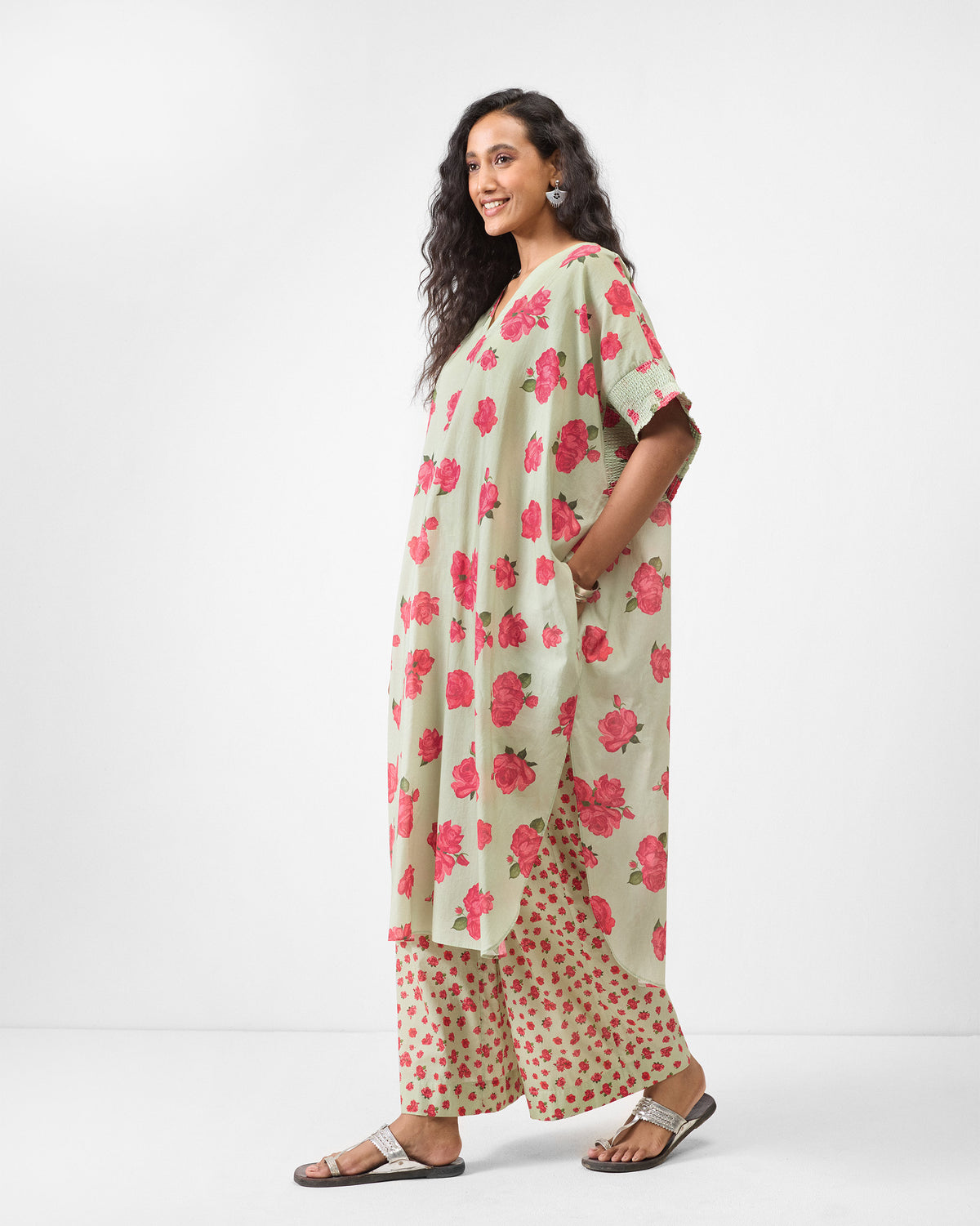 Side view of a mint Calicut kurta with pink rose print and side slit.