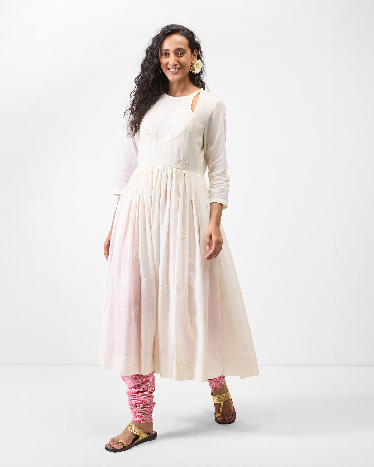 Person wearing an ivory embroidered Fit & Flare Angrakha with a gathered skirt.