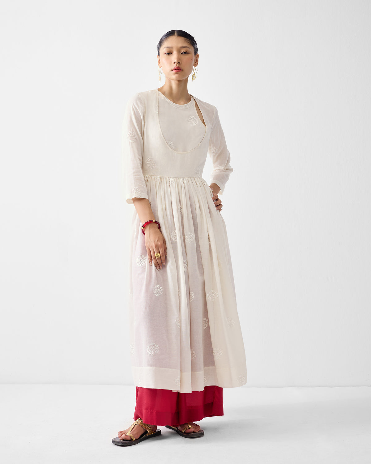 Ivory Fit & Flare Angrakha with tonal floral embroidery on a sheer skirt.