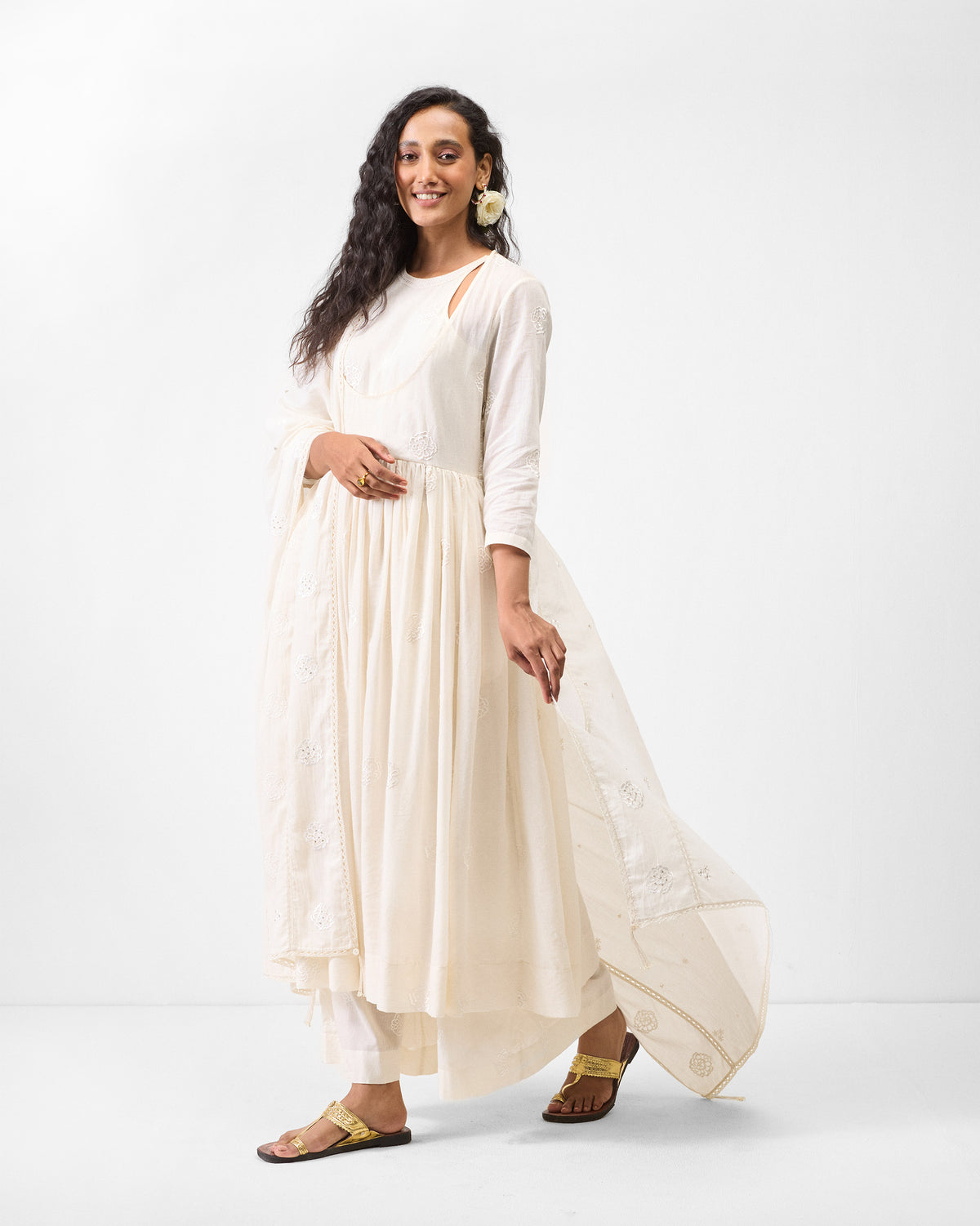 Person wearing an ivory Fit & Flare Angrakha with a sheer embroidered dupatta.