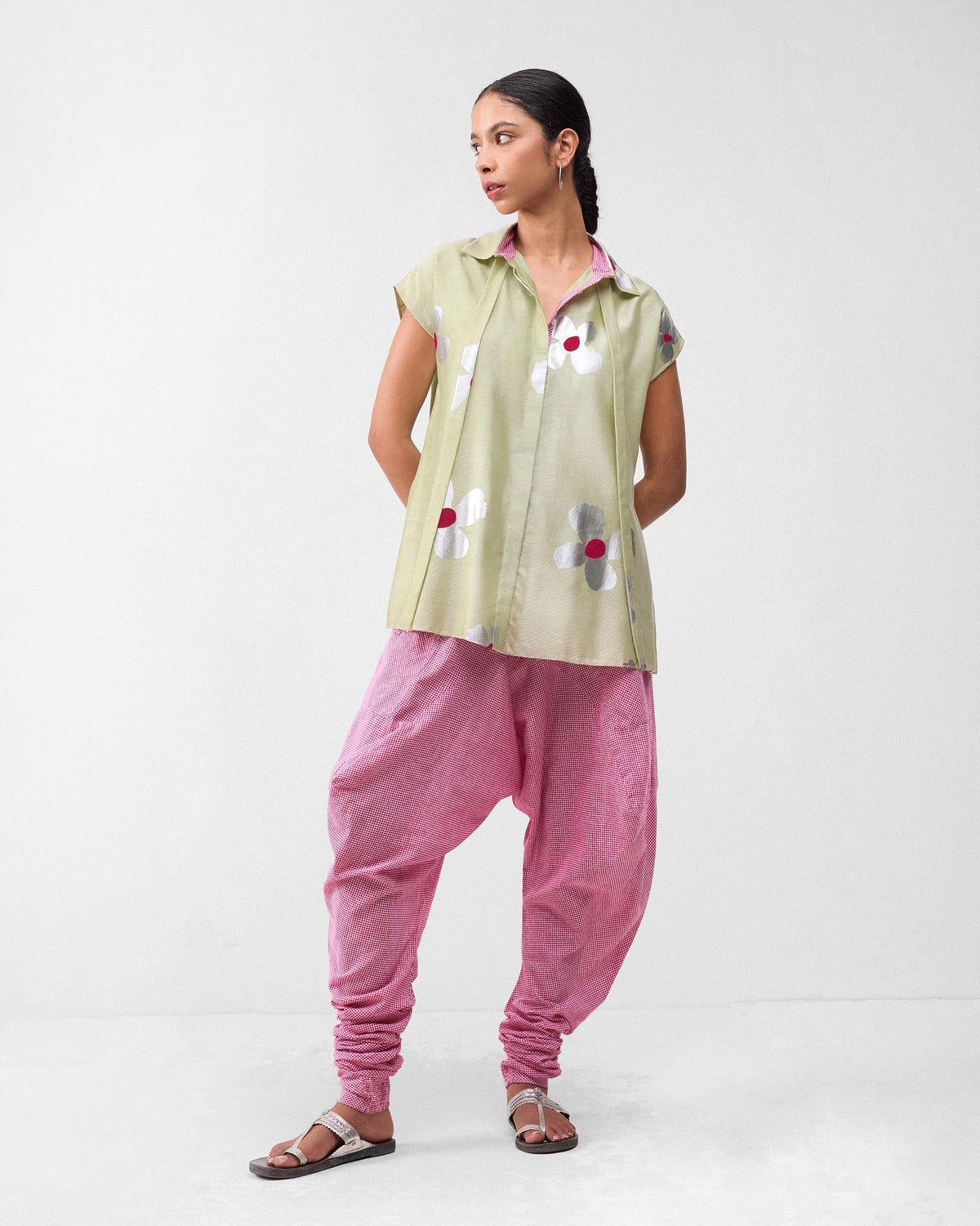 Person wearing watermelon and white check Jaisalmer Pants with gathered ankles.