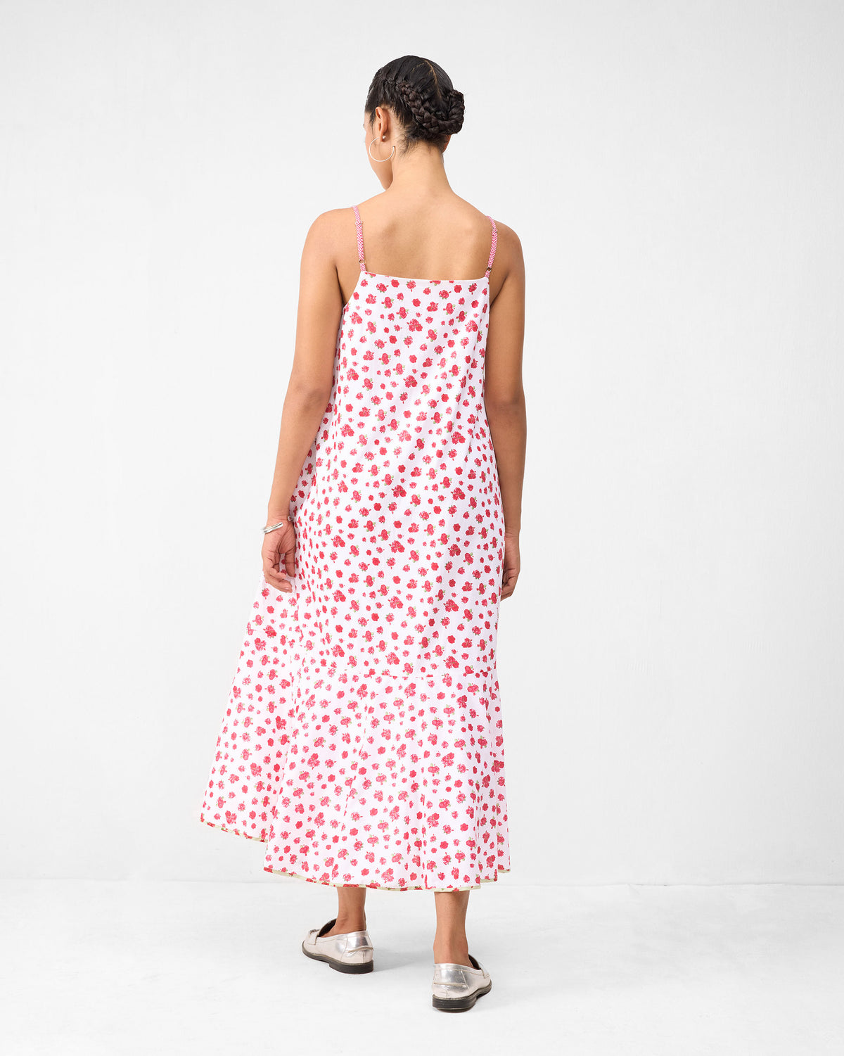 Back of a white Kimsuka Dress with a watermelon floral print.