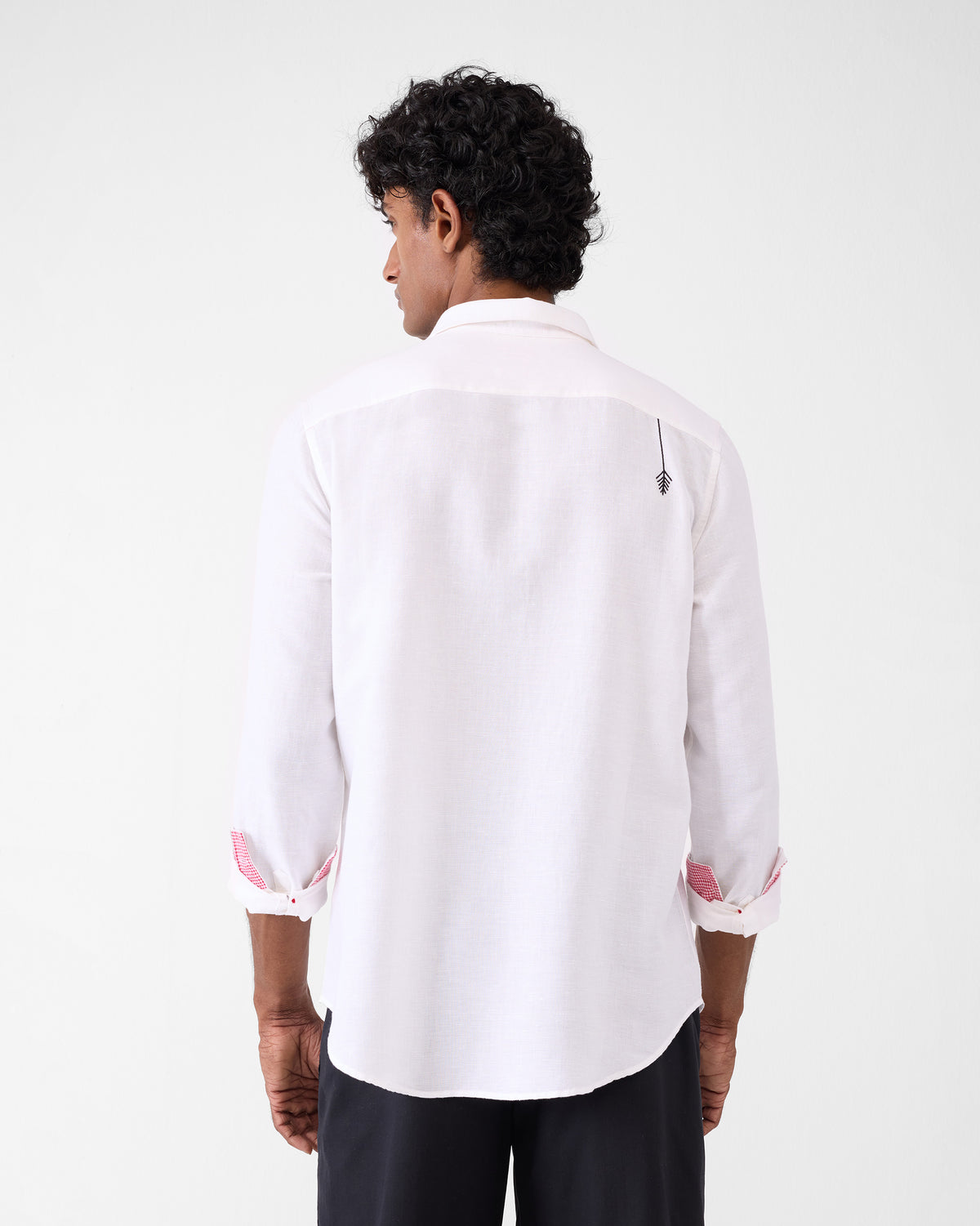 Back of a white Musafir Pocket Shirt with a black plant motif.