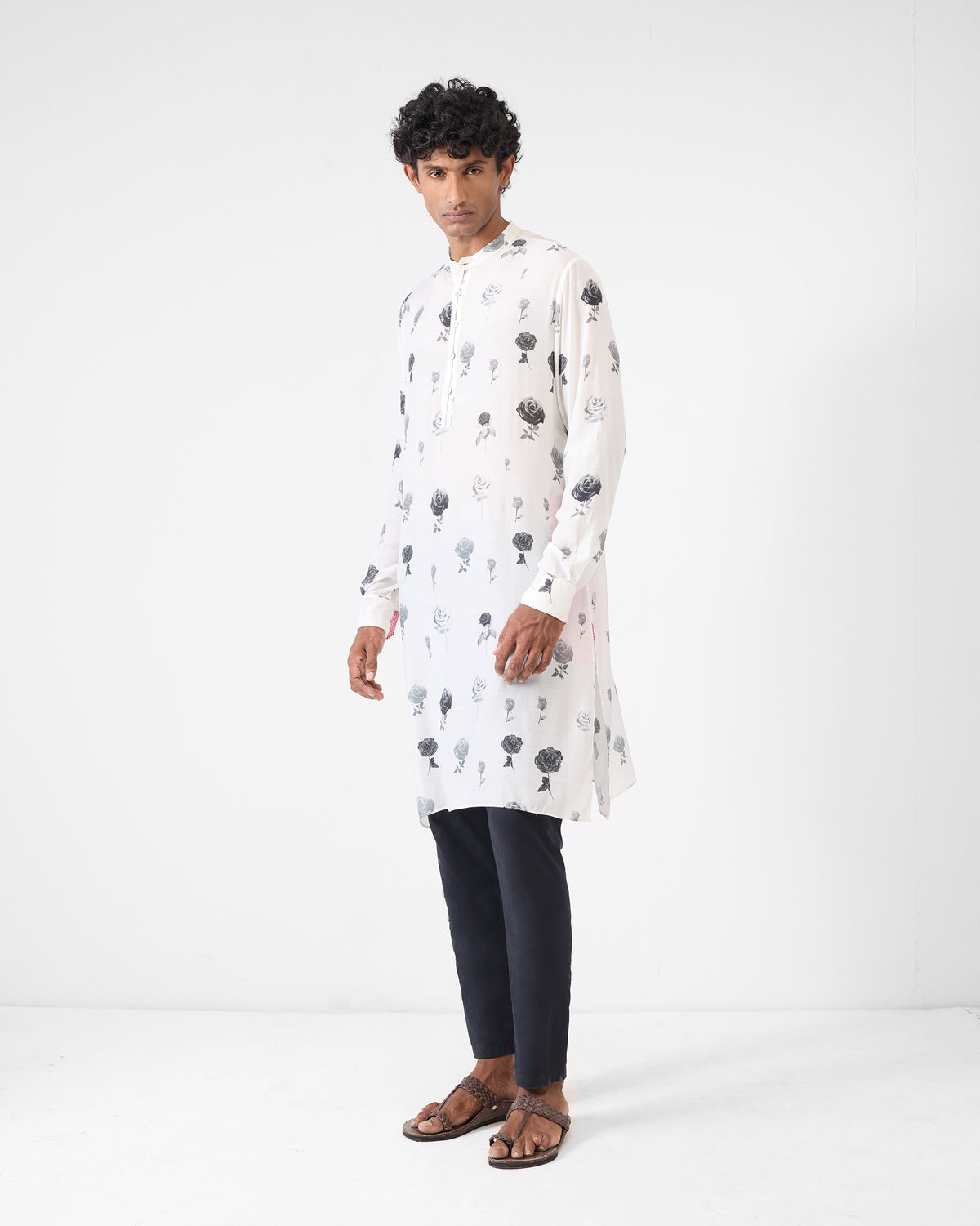 Person wearing a light grey Astral kurta with rose print.