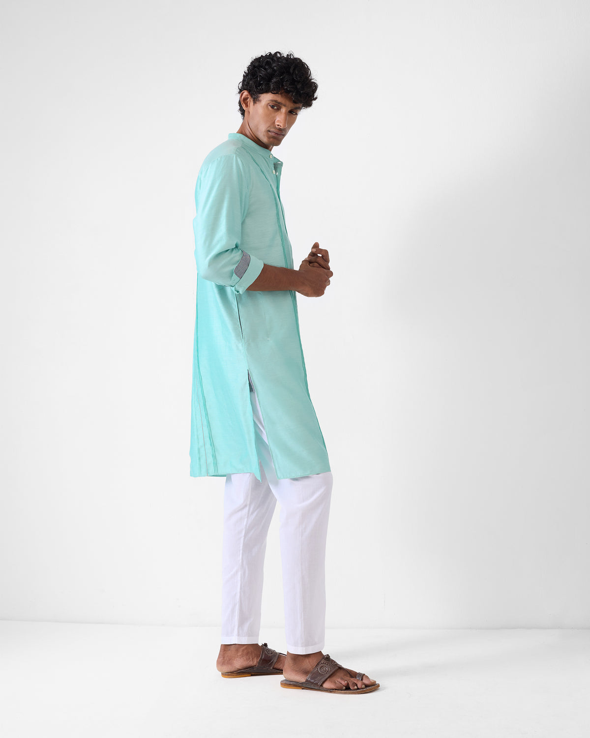 Side view of an aqua Naaz kurta.