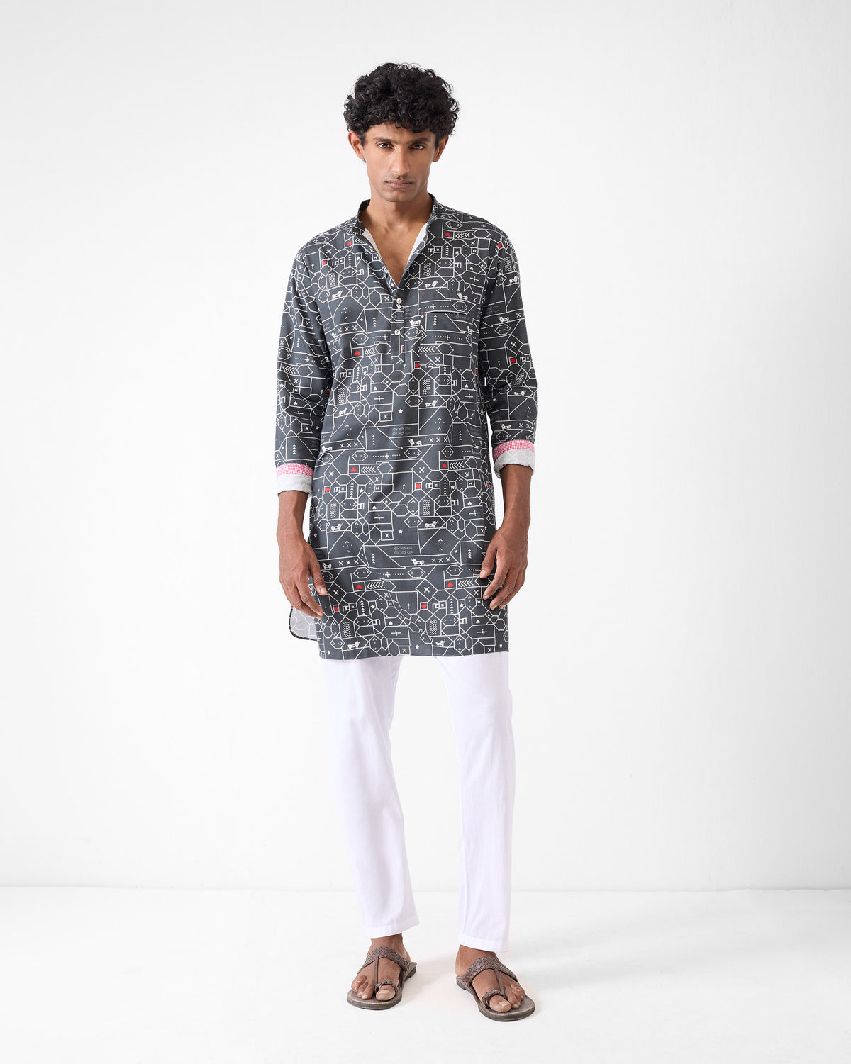 Person wearing a black and grey Galle Kurta with a geometric print.