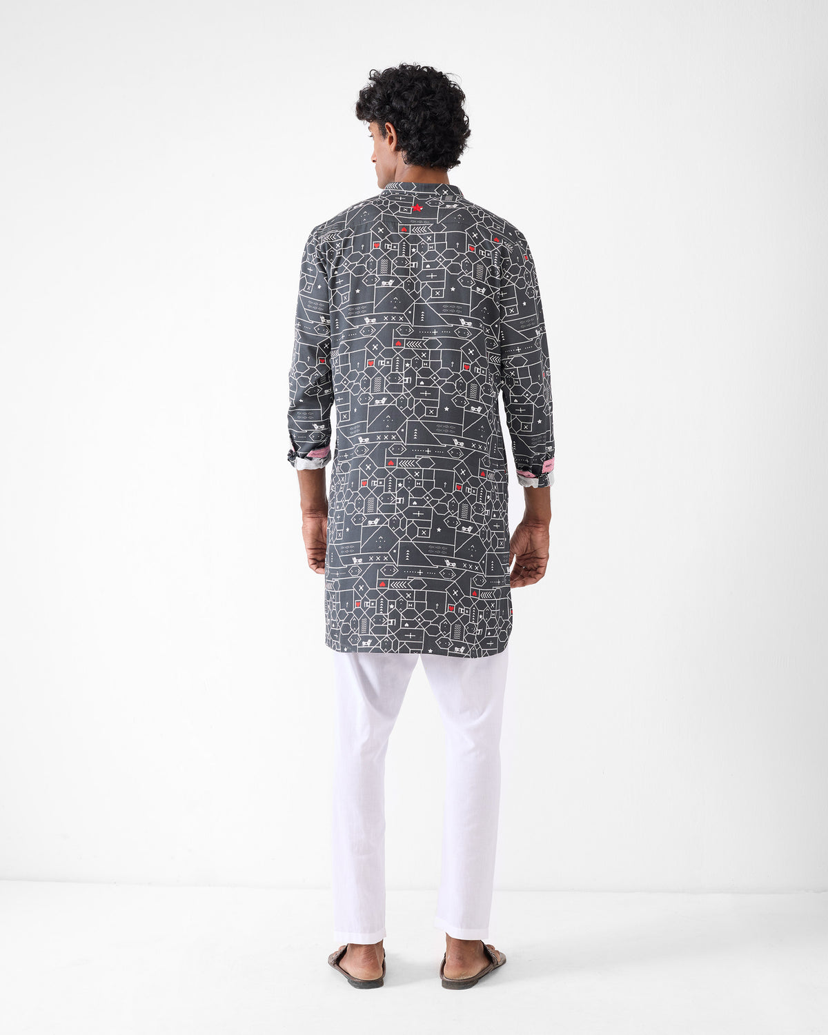 Back of a black and grey Galle Kurta with a geometric print.