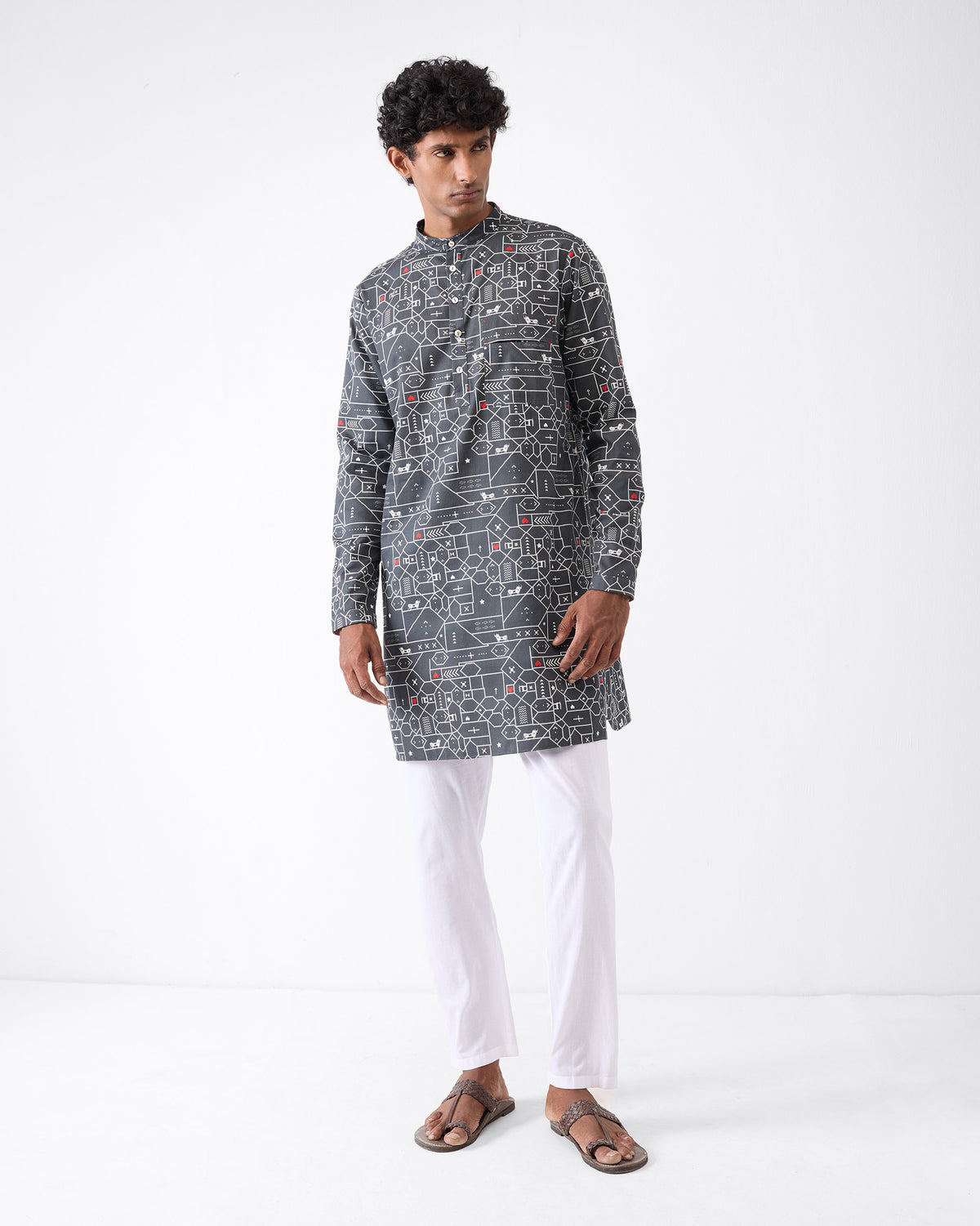 Person wearing a black and grey Galle Kurta with a geometric print.