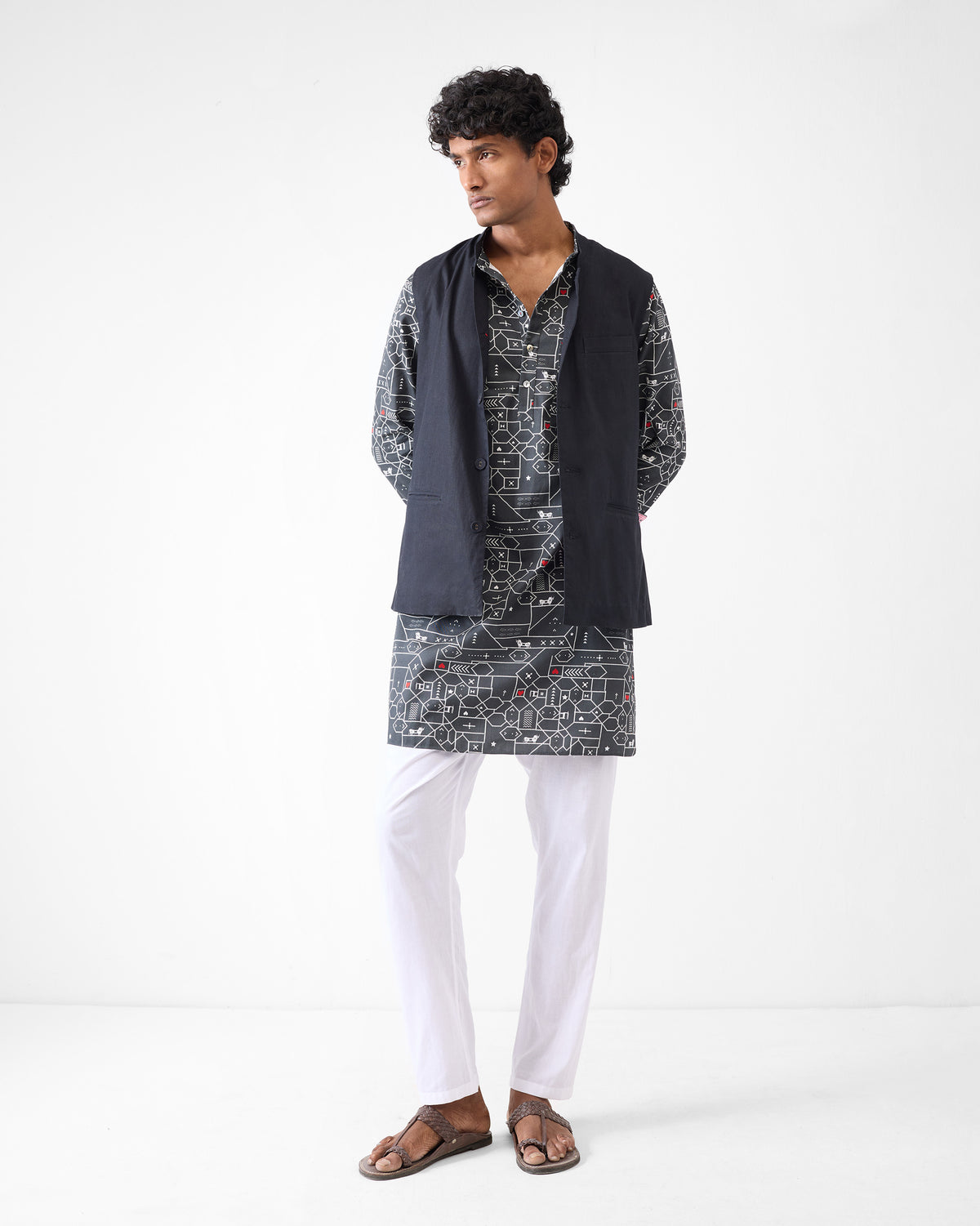 Person wearing a black and grey Galle Kurta with a geometric print.
