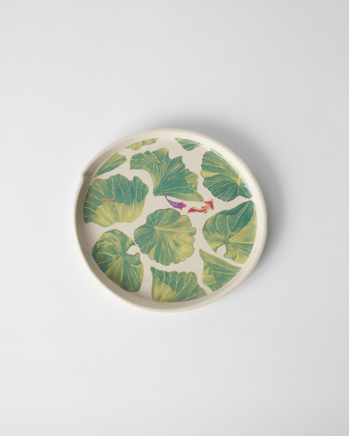 Overhead Lily Pond dessert plate with lily pads and swimming fish.