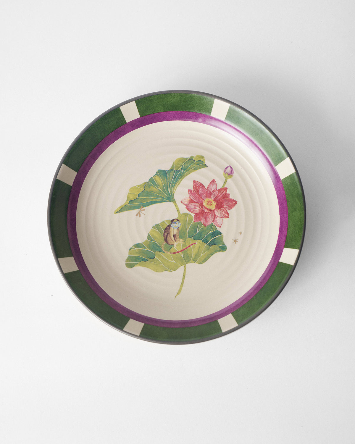 Overhead view of Lotus Garden pasta plate with lotus and monkey.
