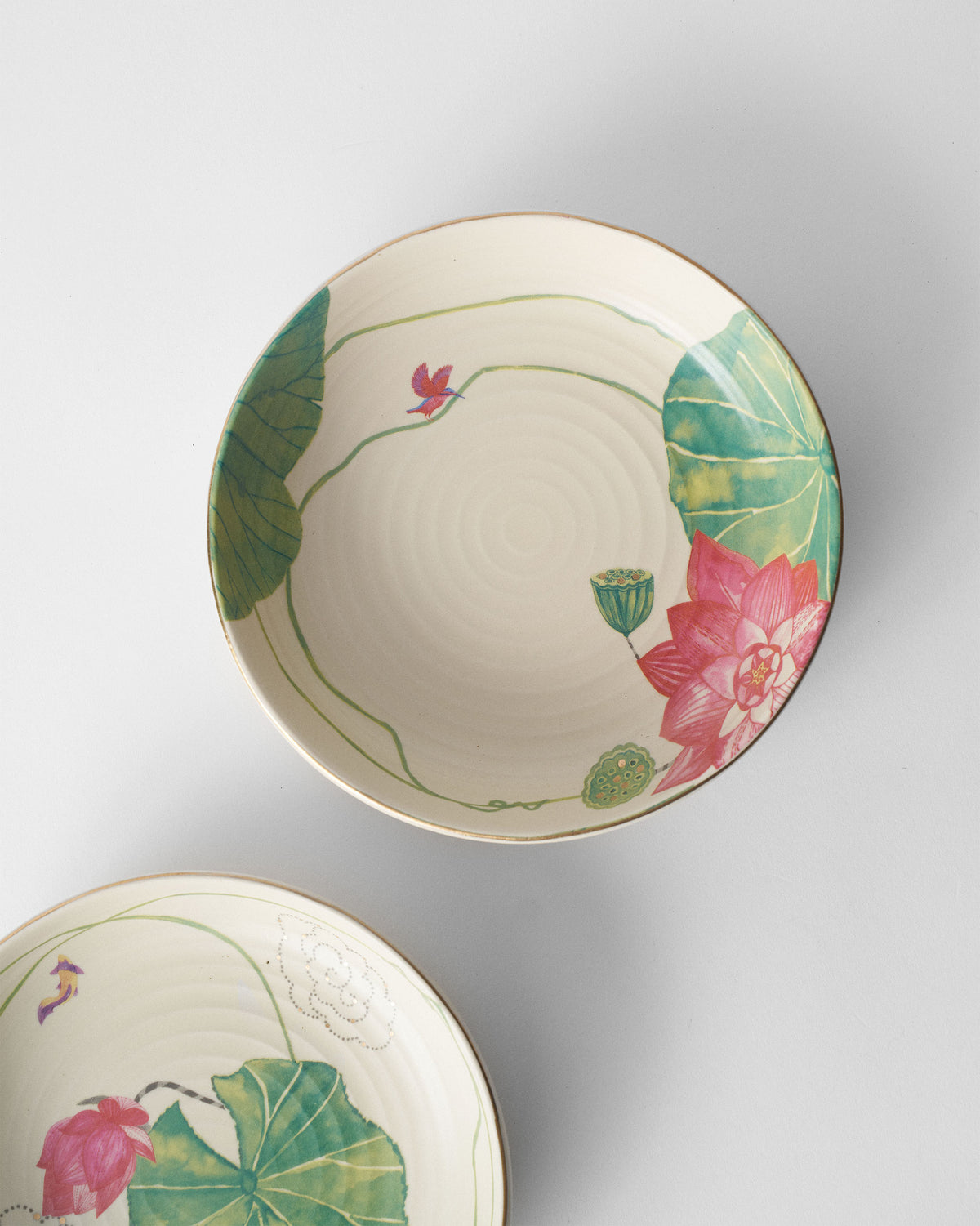 Lotus Garden shallow bowl showing a pink lotus and green leaves.