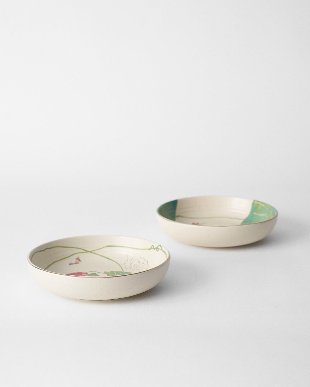 Pair of Lotus Garden shallow bowls showing lotus garden interiors.