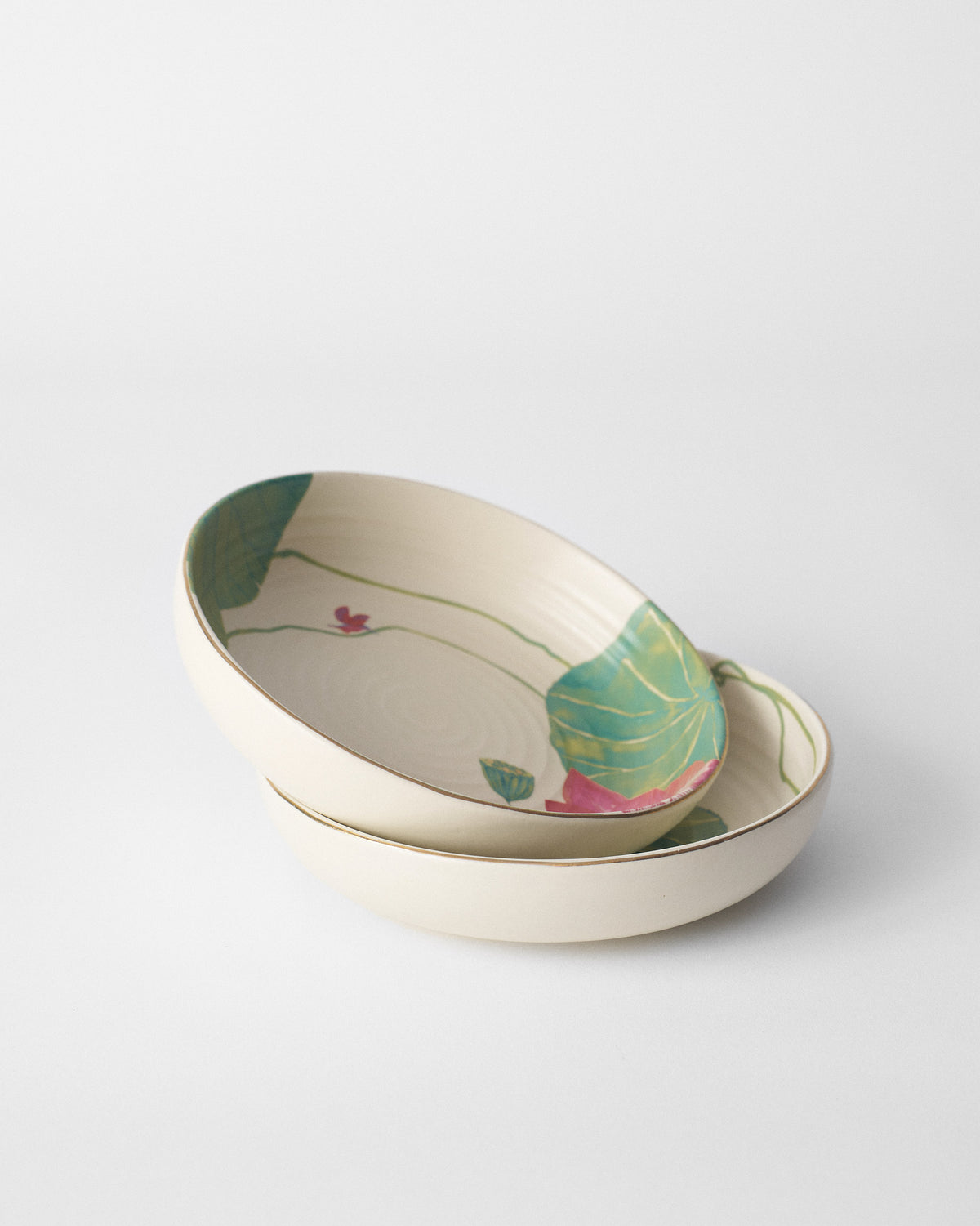 Stacked Lotus Garden shallow bowls with a green leaf and red bird.