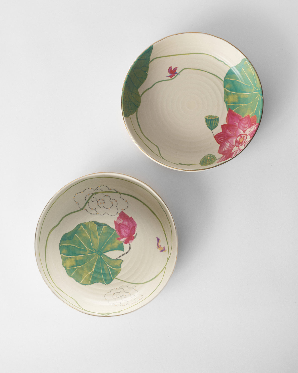 Pair of Lotus Garden shallow bowls showing two lotus interior designs.