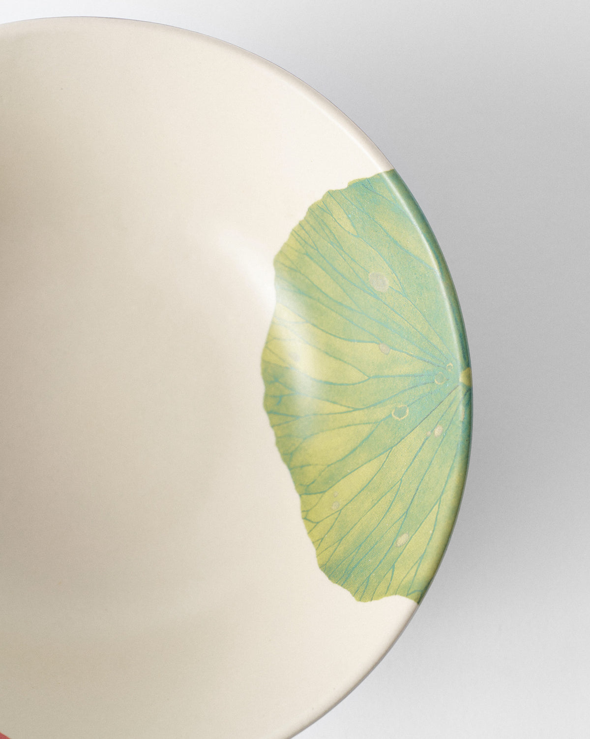 Close-up of Lotus Garden curry bowl showing a green lily pad motif.