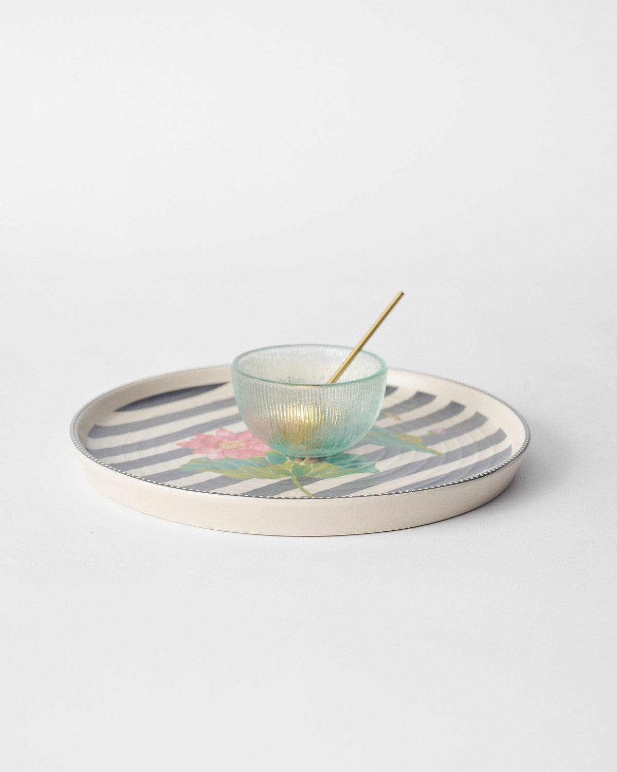 Lily Pond chip and dip platter with pink lotus and a green glass bowl.