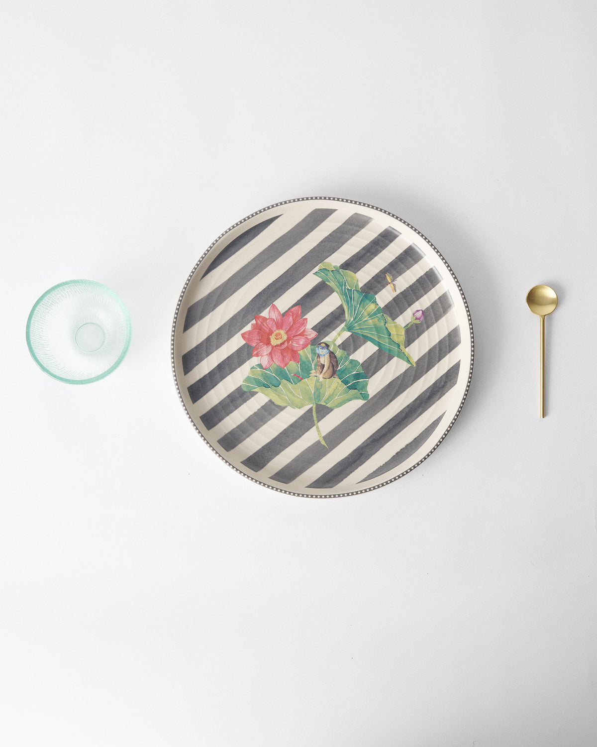 Lily Pond platter with pink lotus, leaves, and a monkey on charcoal stripes.