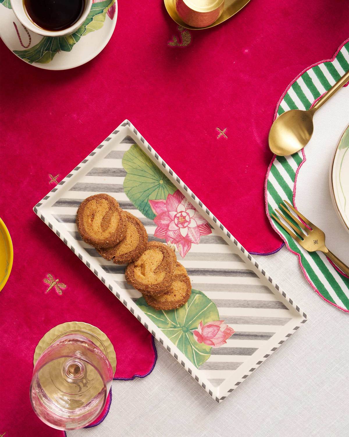 Lotus Garden cookie tray holding spiral cookies on a dining table.