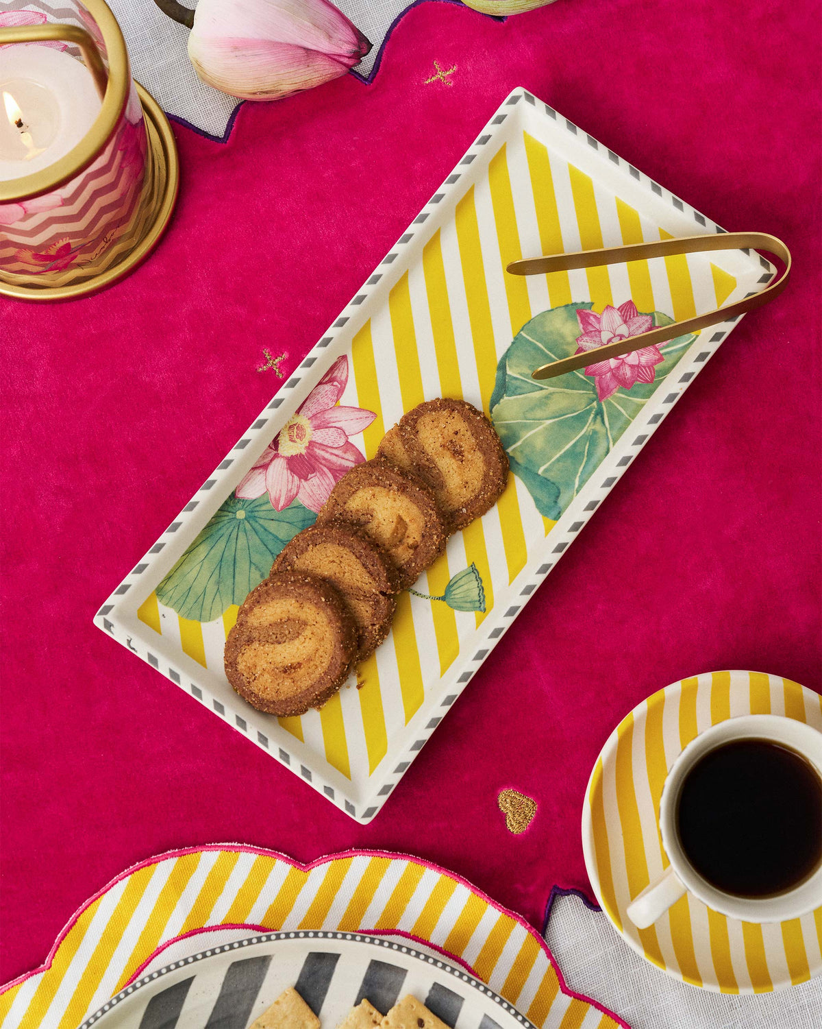 Yellow Lotus Garden cookie tray holding spiral cookies on a dining table.