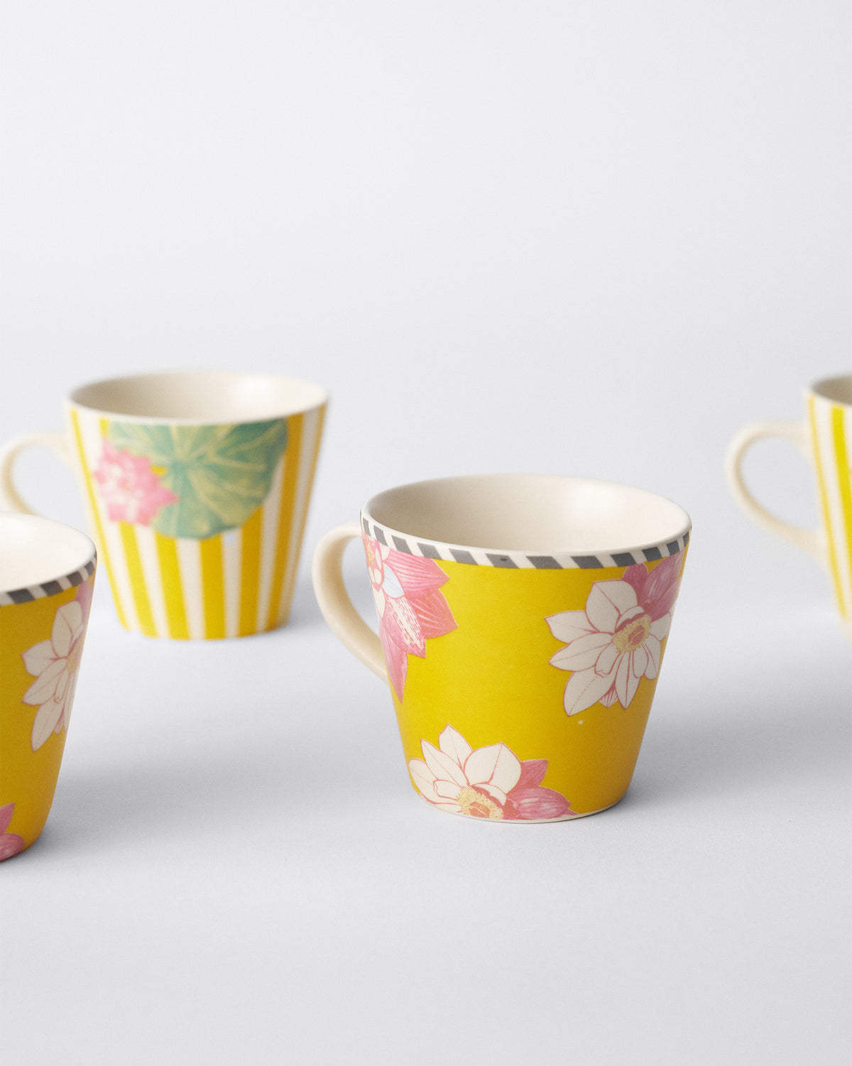 Lotus Garden espresso mugs showing lotus and striped leaf prints.