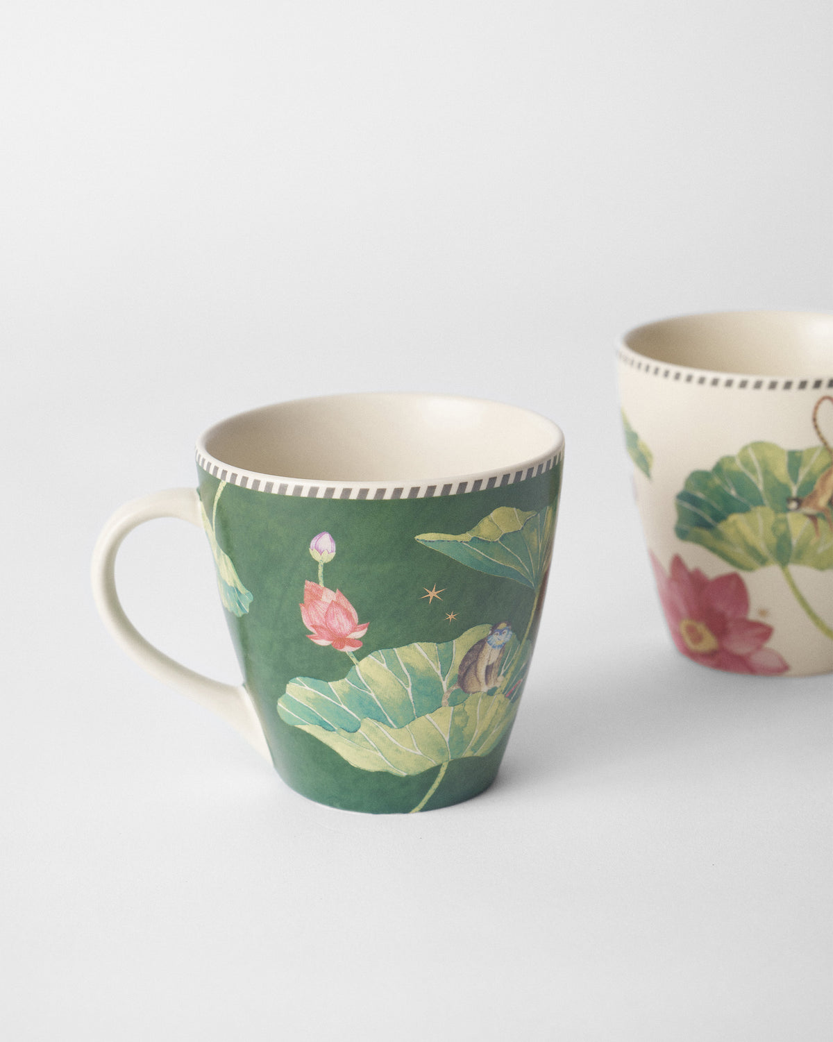 Green Float conical mug with lotus leaves and a monkey.