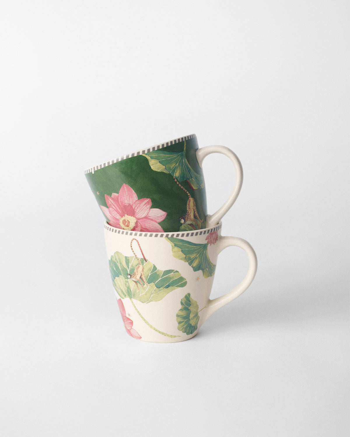 Stacked Float conical mugs with lotus flowers and leaves.