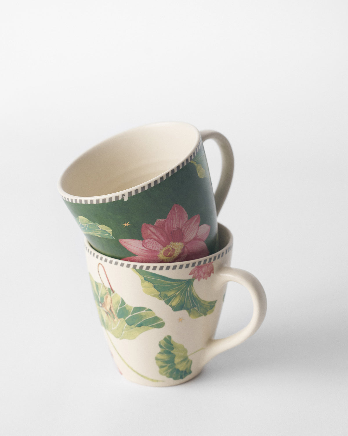 Stacked Float conical mugs with lotus flowers and leaves.