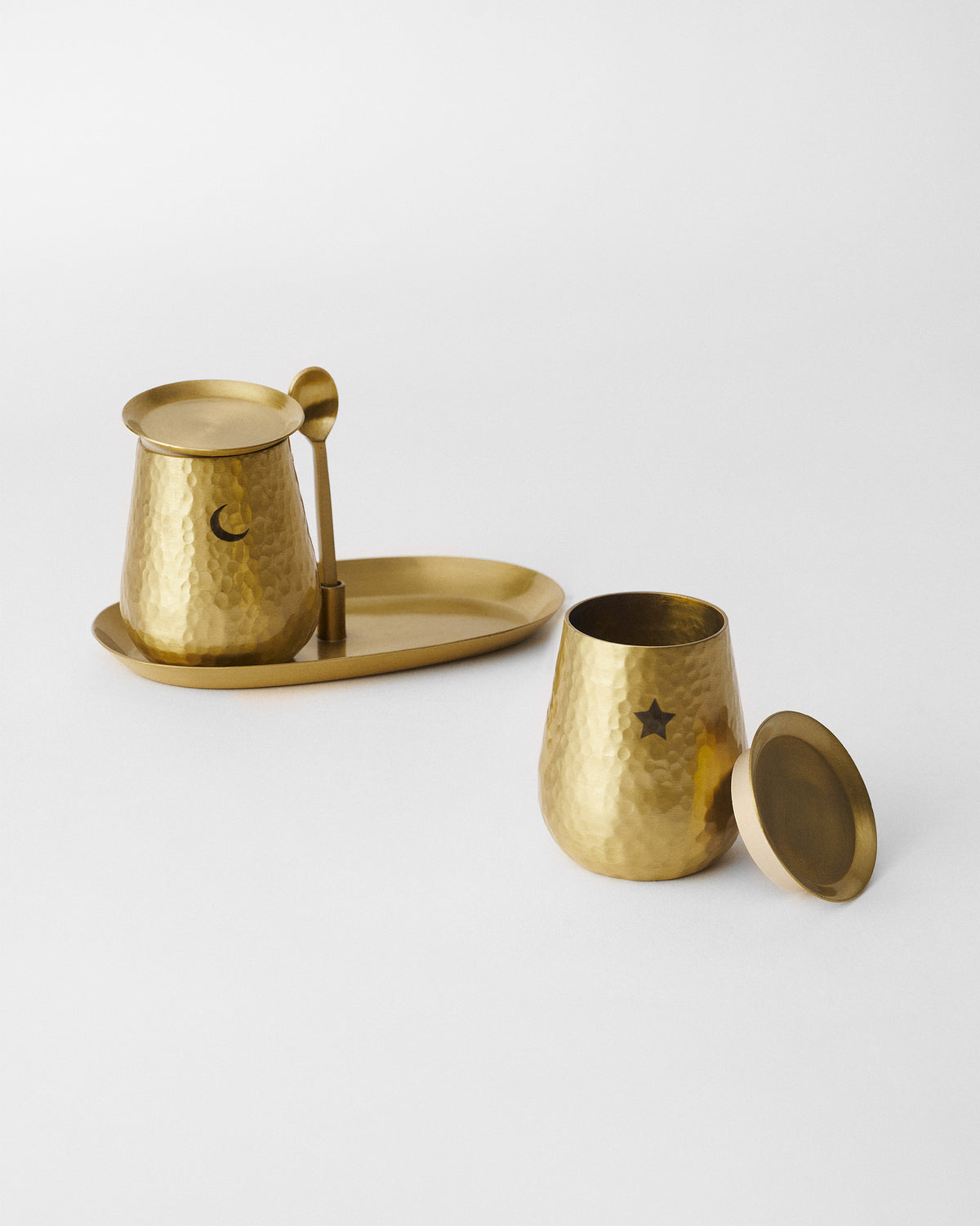 Chand Sitara salt and pepper pots with moon and star motifs on a tray.