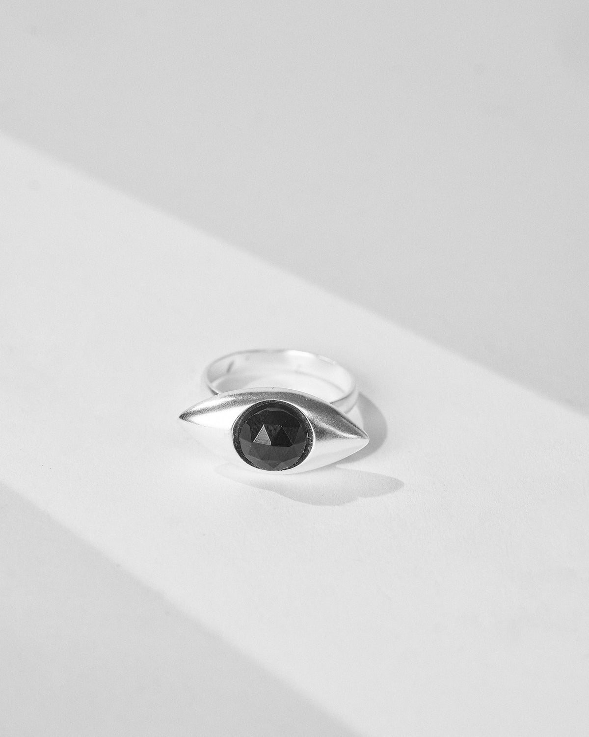 Silver All Seeing Ring with a round black onyx in an eye setting.