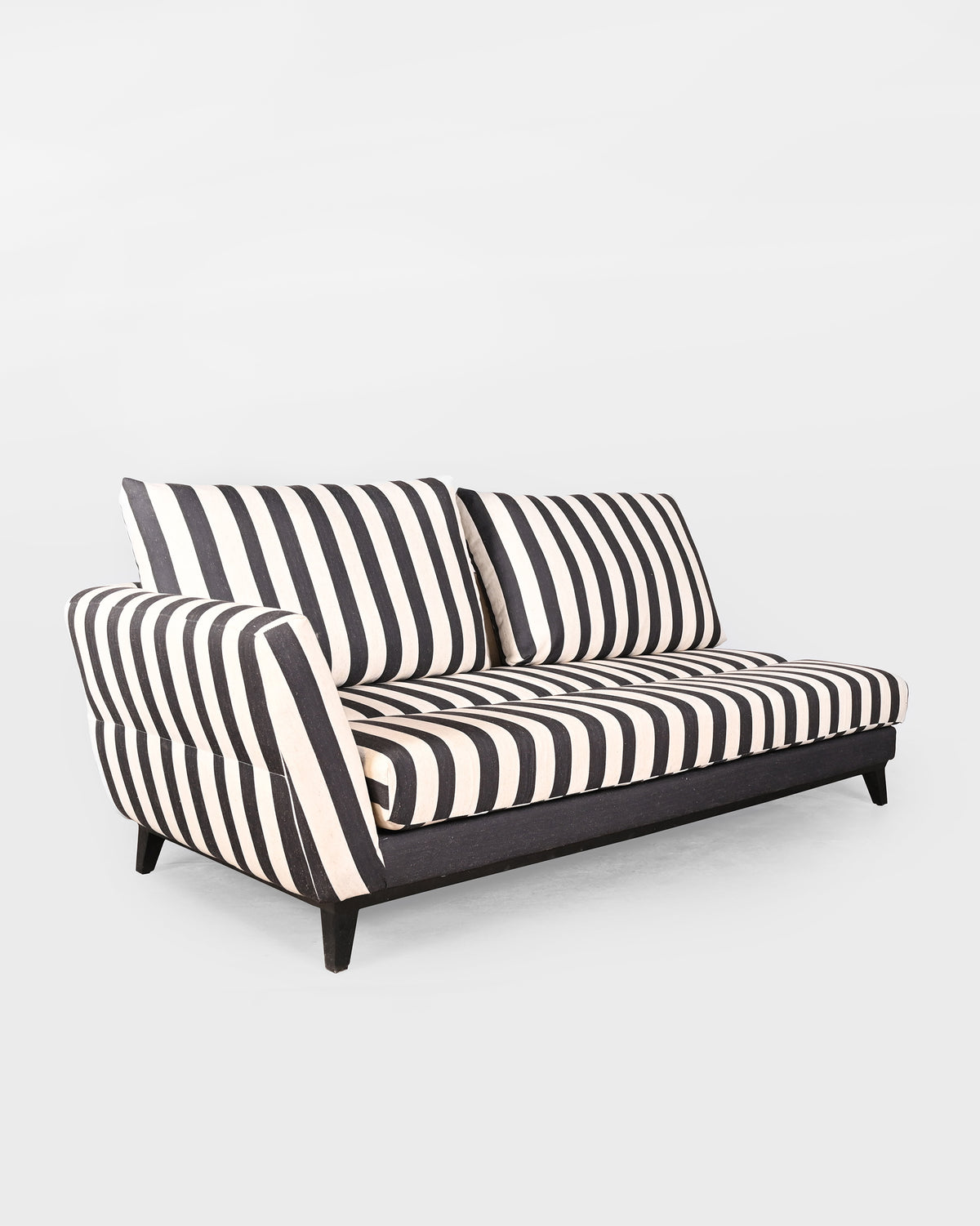 Angled view of the charcoal striped Ele Grove sofa showing deep seat cushions.