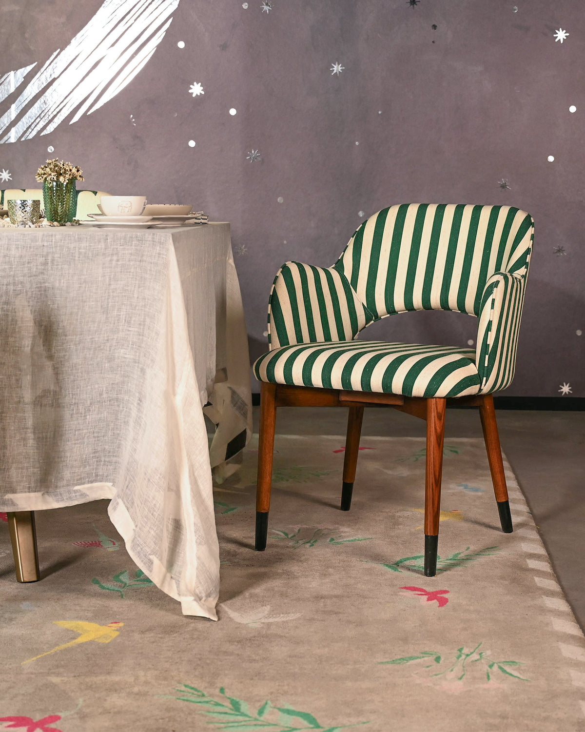 Rhythm dining chair in green and cream stripes with wooden legs.