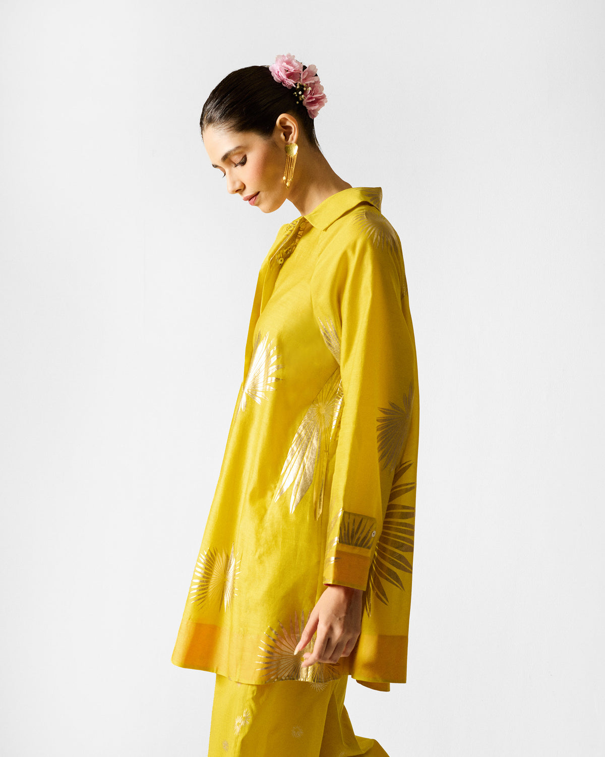 Side view of a chartreuse Flare Panelled Shirt with gold palm prints.