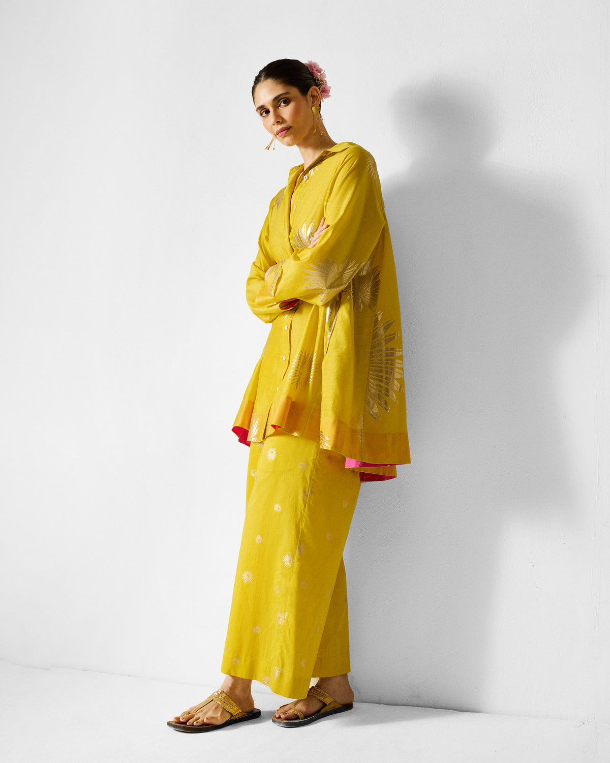 Person wearing a chartreuse Flare Panelled Shirt with gold palm prints.