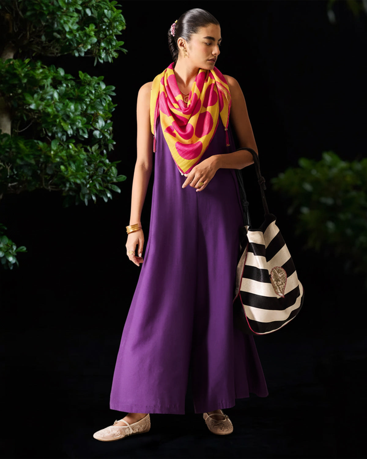 Purple Amreli jumpsuit with a sleeveless V-neck and wide legs.