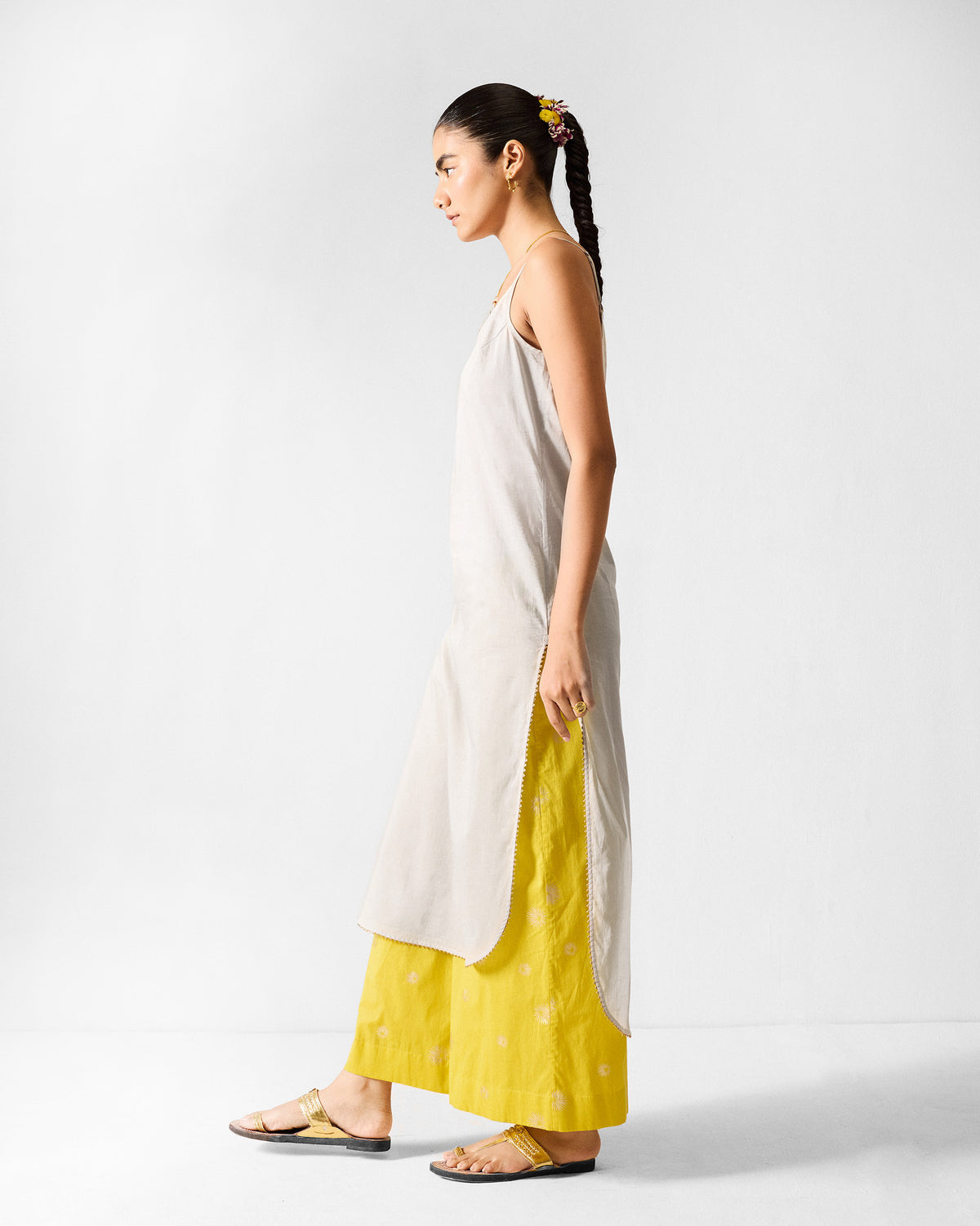 Side view of a grey Kumaon Slip showing the curved side slit.