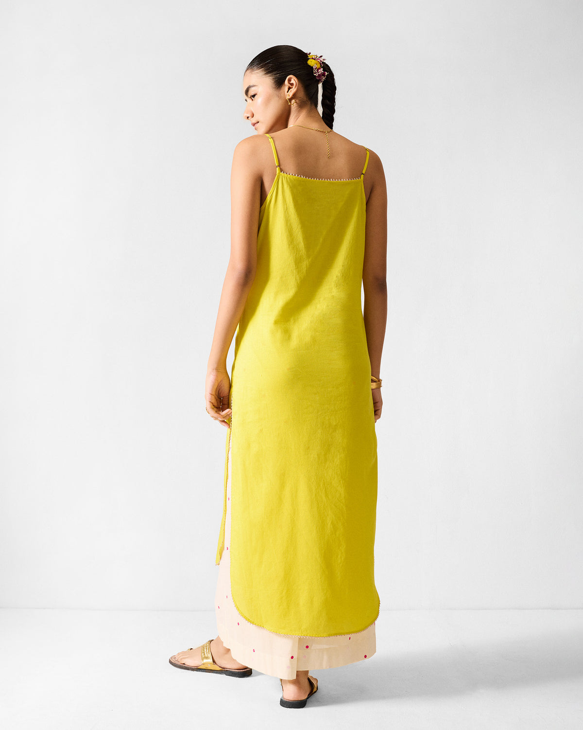 Back of a lime Kumaon slip with thin straps.
