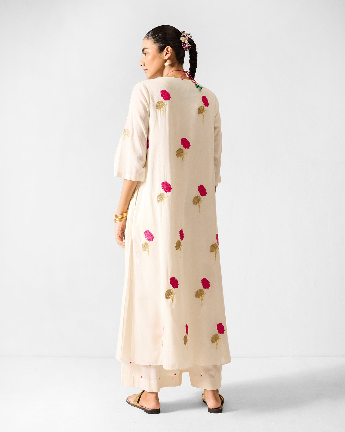 Back of an ivory Hampi Kurta with fuchsia floral embroidery.