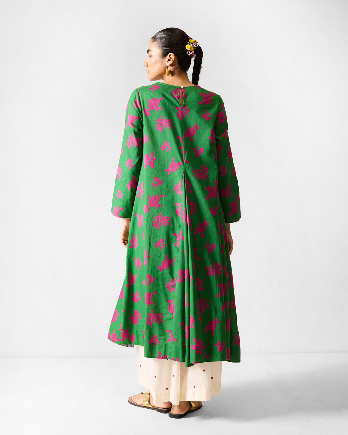 Back of a green and fuchsia printed Ayat kurta with a centre back pleat.