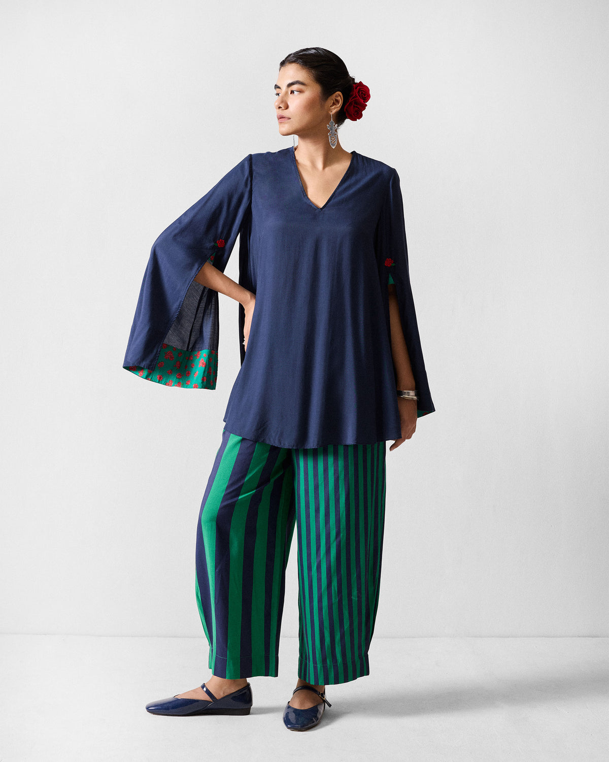 Person wearing a dark navy Panaji Top with split sleeves and a V-neck.