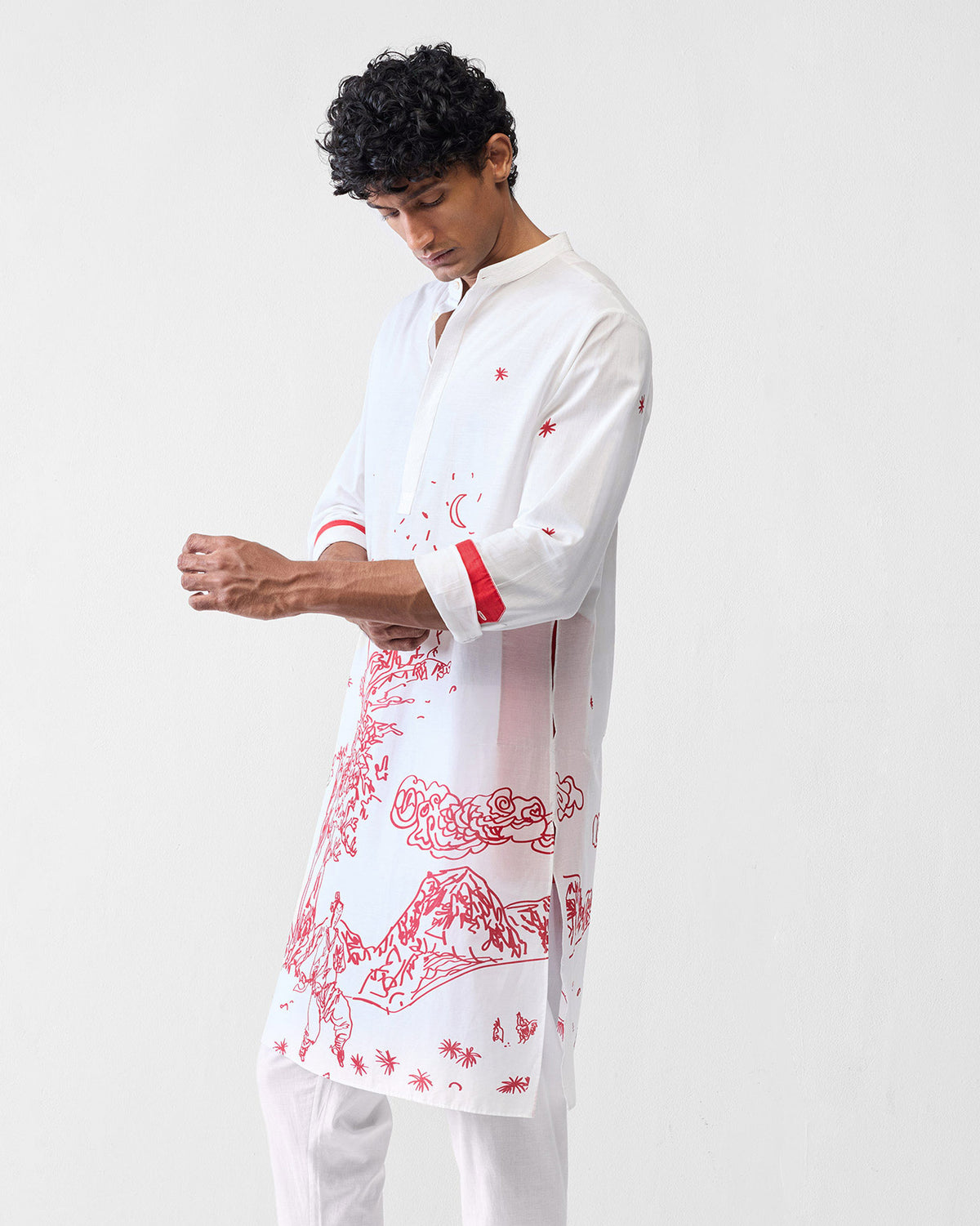 Side view of a white Neckband Kurta with a red landscape print and red cuff bands.
