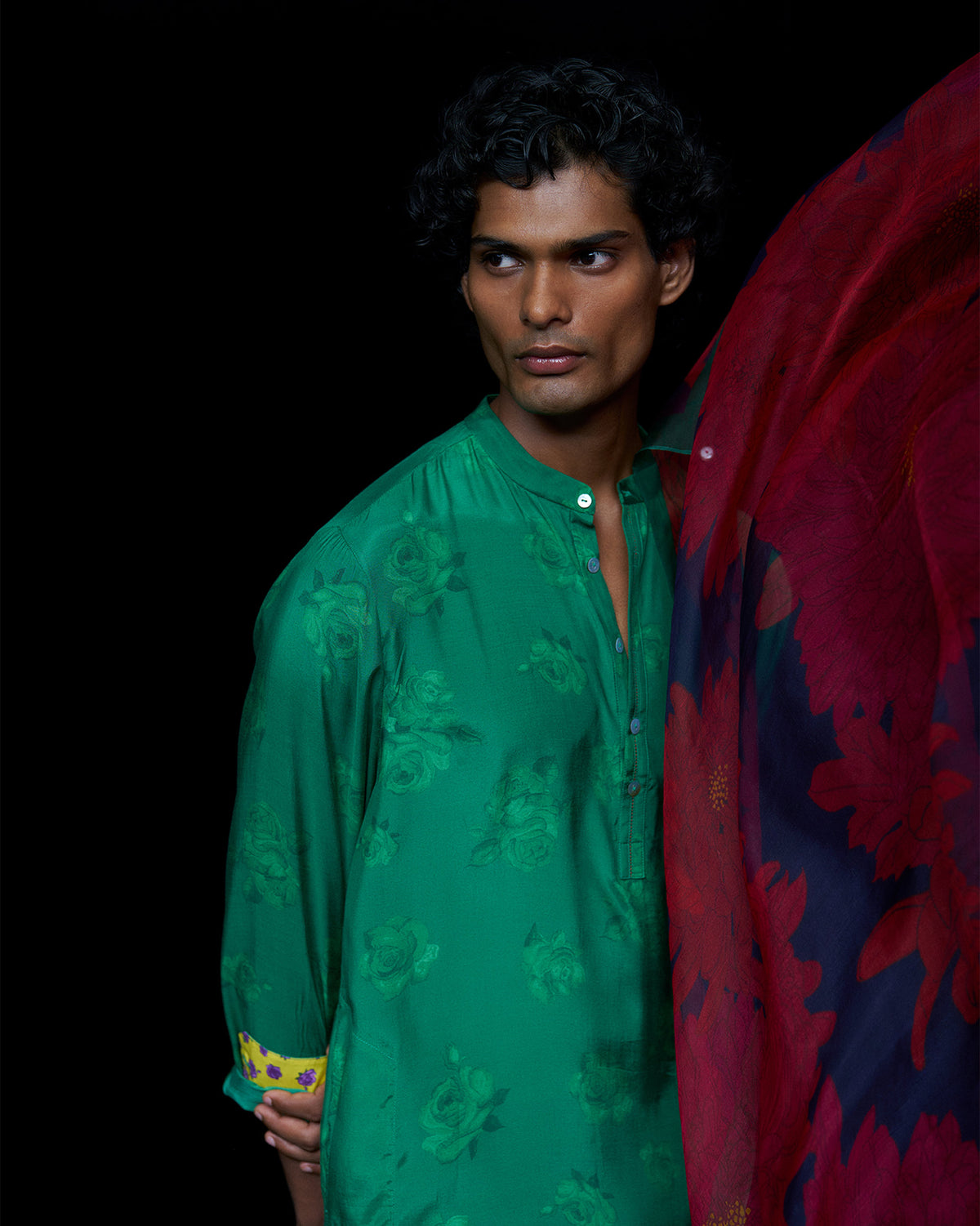 Emerald green Astral kurta with tonal roses and a yellow floral cuff lining.