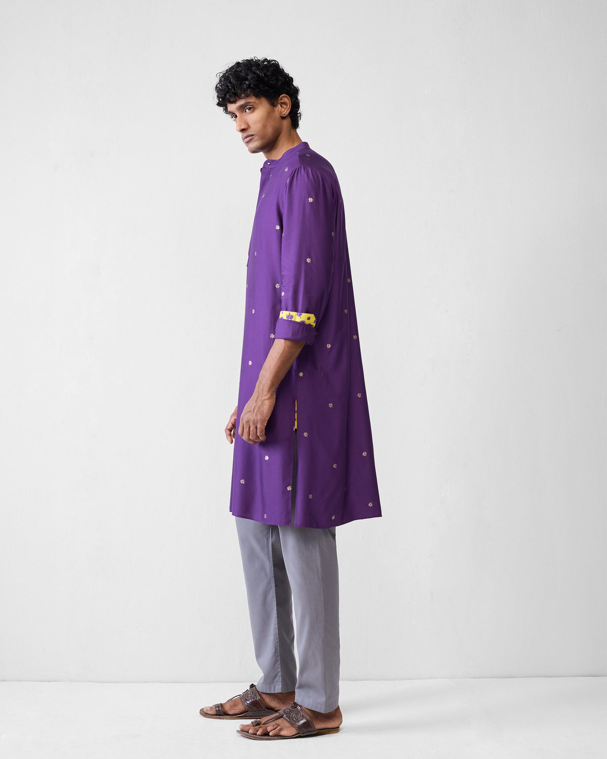 Side view of a purple Neckband Kurta showing the yellow lined side slit.